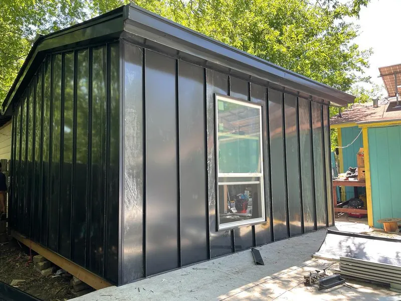 Black standing seam metal wall panels for Roof Inspection in Ontario